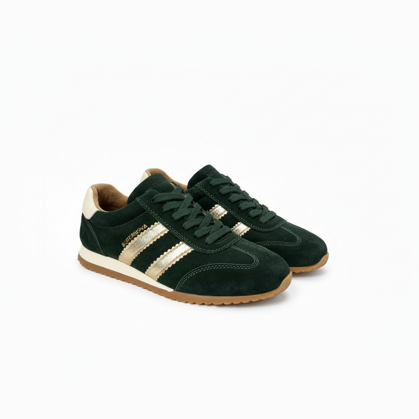 A pair of dark green suede sneakers with metallic gold three-stripes, gold 'SUPERNOVA' branding, and brown gum soles, shown on a white background.