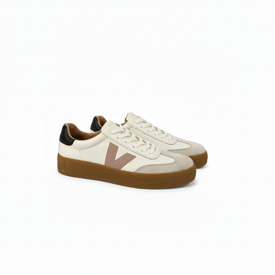 A pair of low-top sneakers in off-white leather and suede with a dusty pink V logo, brown gum soles, and black heel tabs, shown on a white background.